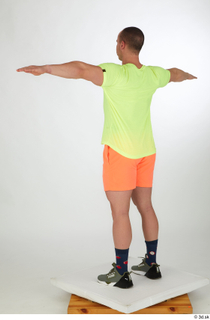 Joel dressed green sneakers orange shorts sports standing t-pose whole…